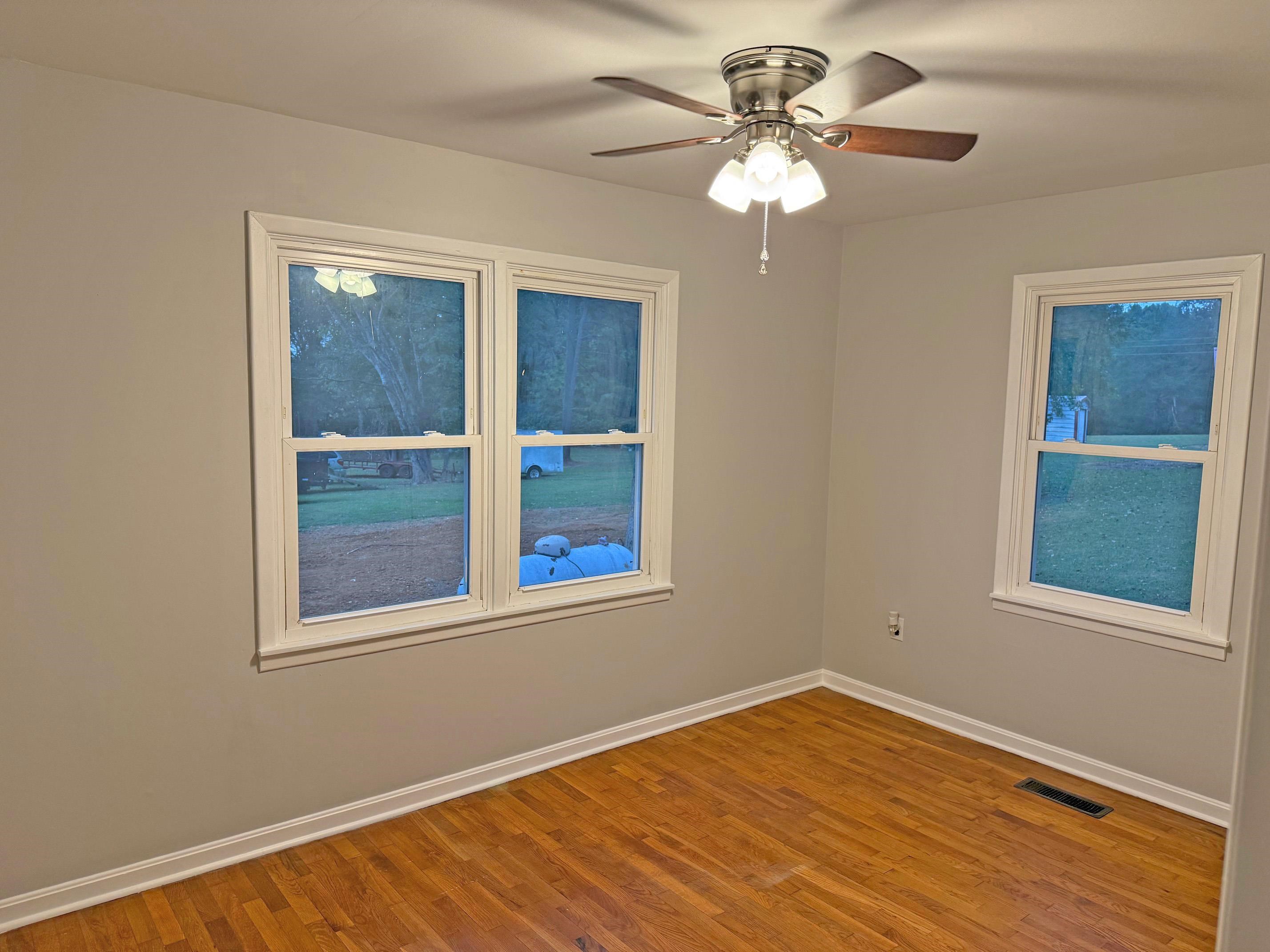 8540-8530 Glendale Road Morris Chapel, TN 38361 - Photo 11 of 21 a view of an empty room with a window and a chandelier fan