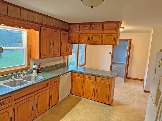 a kitchen with stainless steel appliances granite countertop a sink and a granite counter tops