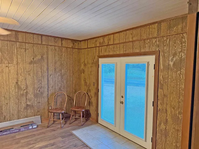 a view of a door and chair in a room