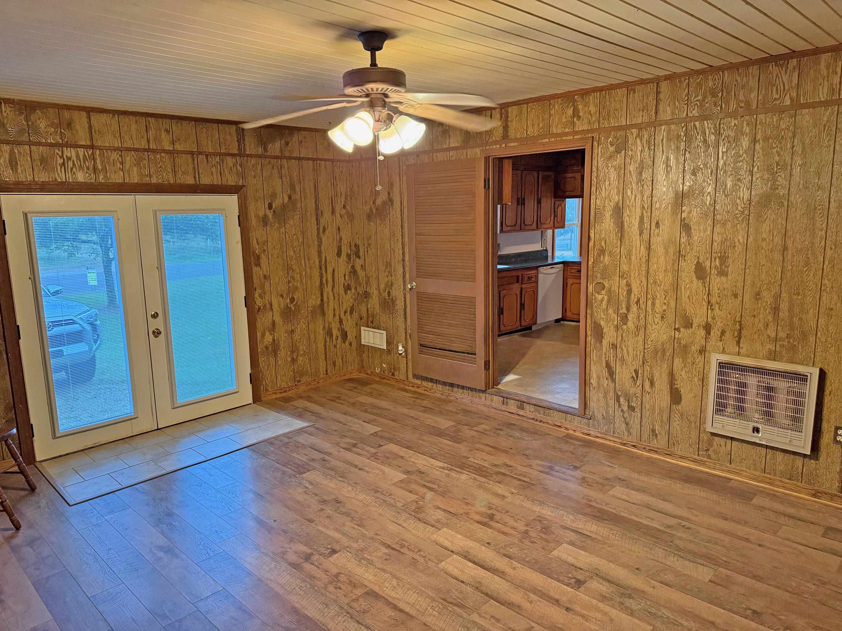 8540-8530 Glendale Road Morris Chapel, TN 38361 - Photo 8 of 21 a view of empty room with wooden floor and fan