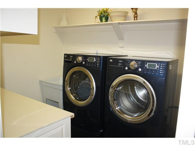 155 Old Murphy Road Zebulon, NC 27597 - Photo 25 of 25 LAUNDRY ROOM w/ FOLDING CABINET AND SINK