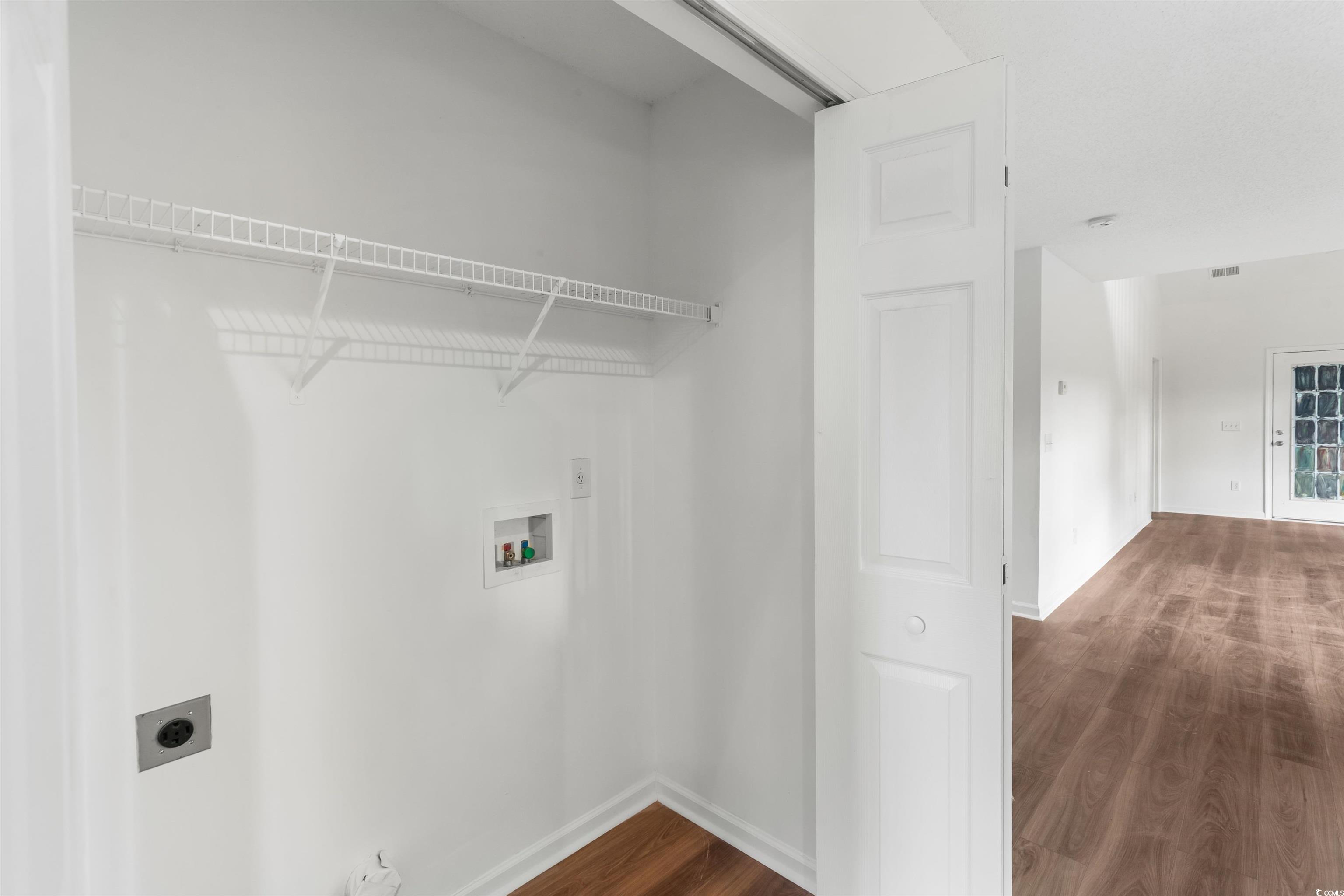 130 Wimbledon Way, Unit 130 Murrells Inlet, SC 29576 - Photo 14 of 38 Laundry room featuring hardwood / wood-style floor