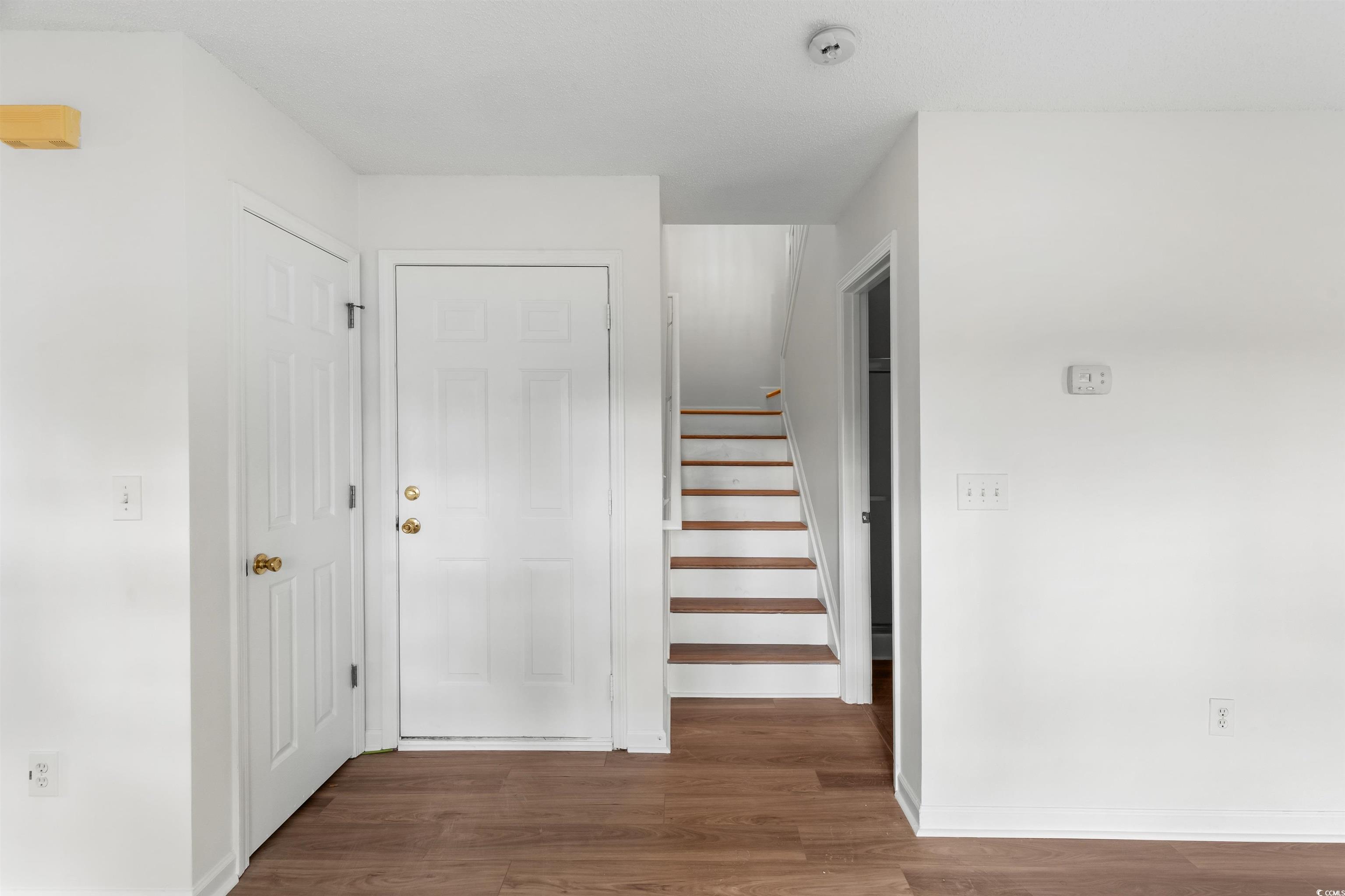 130 Wimbledon Way, Unit 130 Murrells Inlet, SC 29576 - Photo 15 of 38 Stairway with hardwood / wood-style flooring