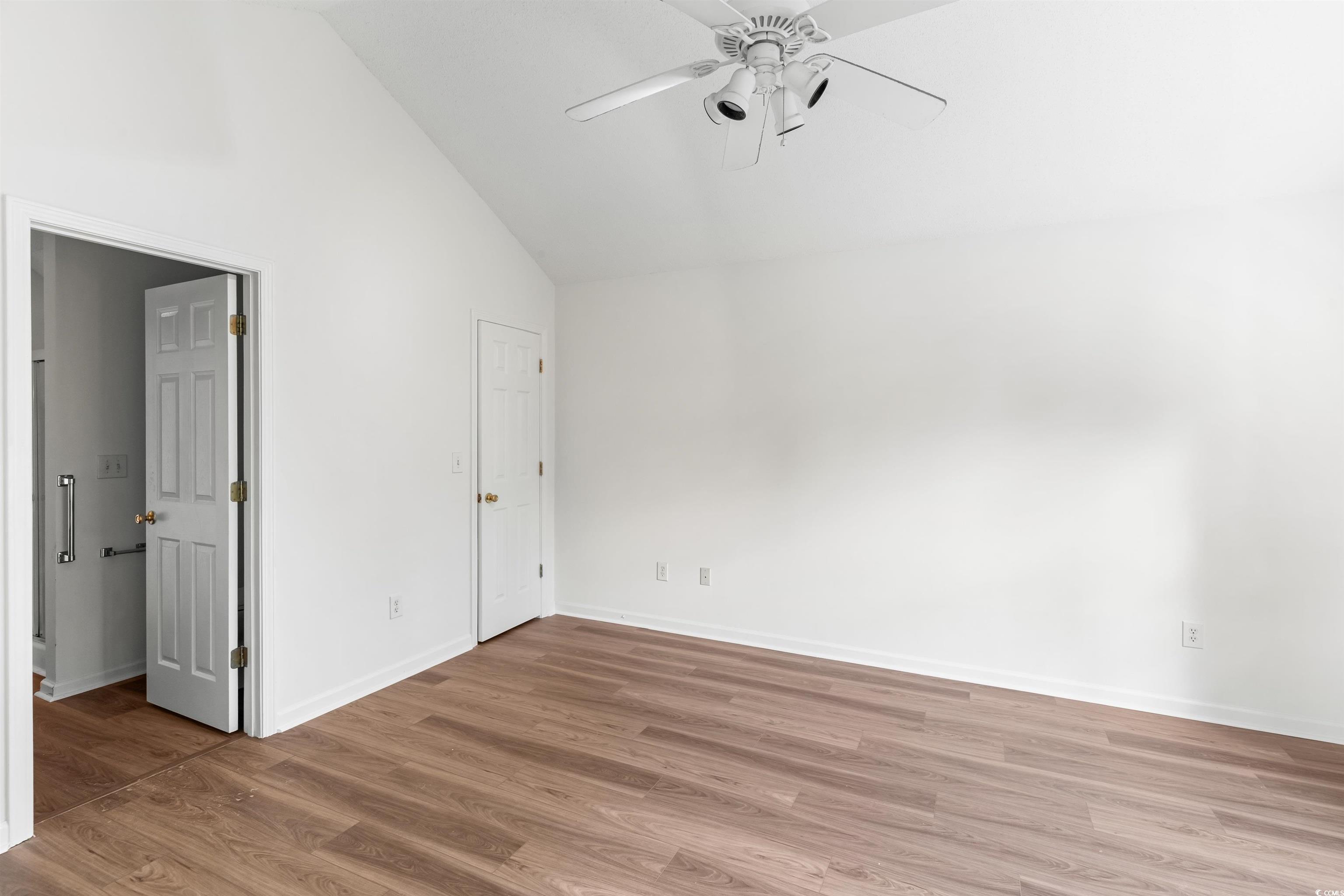 130 Wimbledon Way, Unit 130 Murrells Inlet, SC 29576 - Photo 16 of 38 Empty room featuring high vaulted ceiling, light h