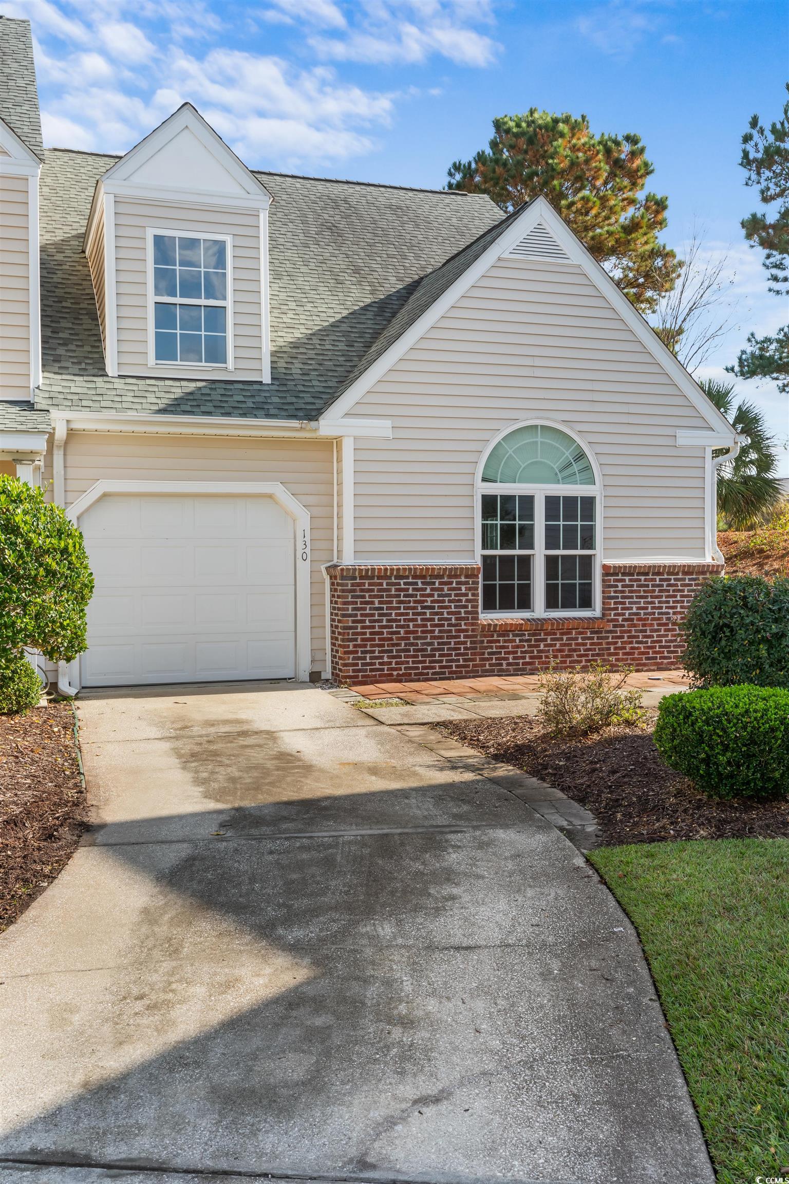 130 Wimbledon Way, Unit 130 Murrells Inlet, SC 29576 - Photo 2 of 38 View of front of house with a garage