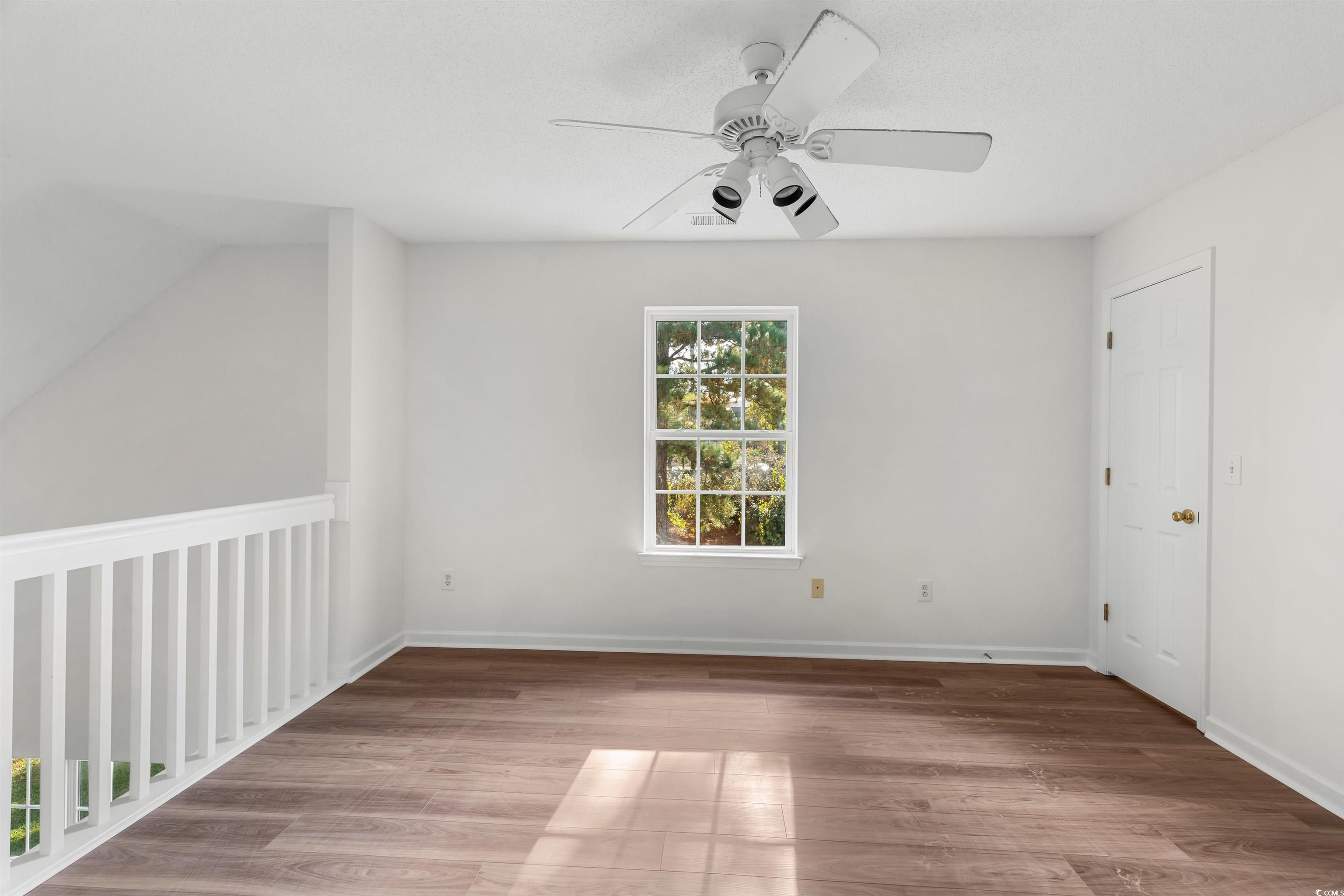 130 Wimbledon Way, Unit 130 Murrells Inlet, SC 29576 - Photo 26 of 38 Unfurnished room featuring hardwood / wood-style f