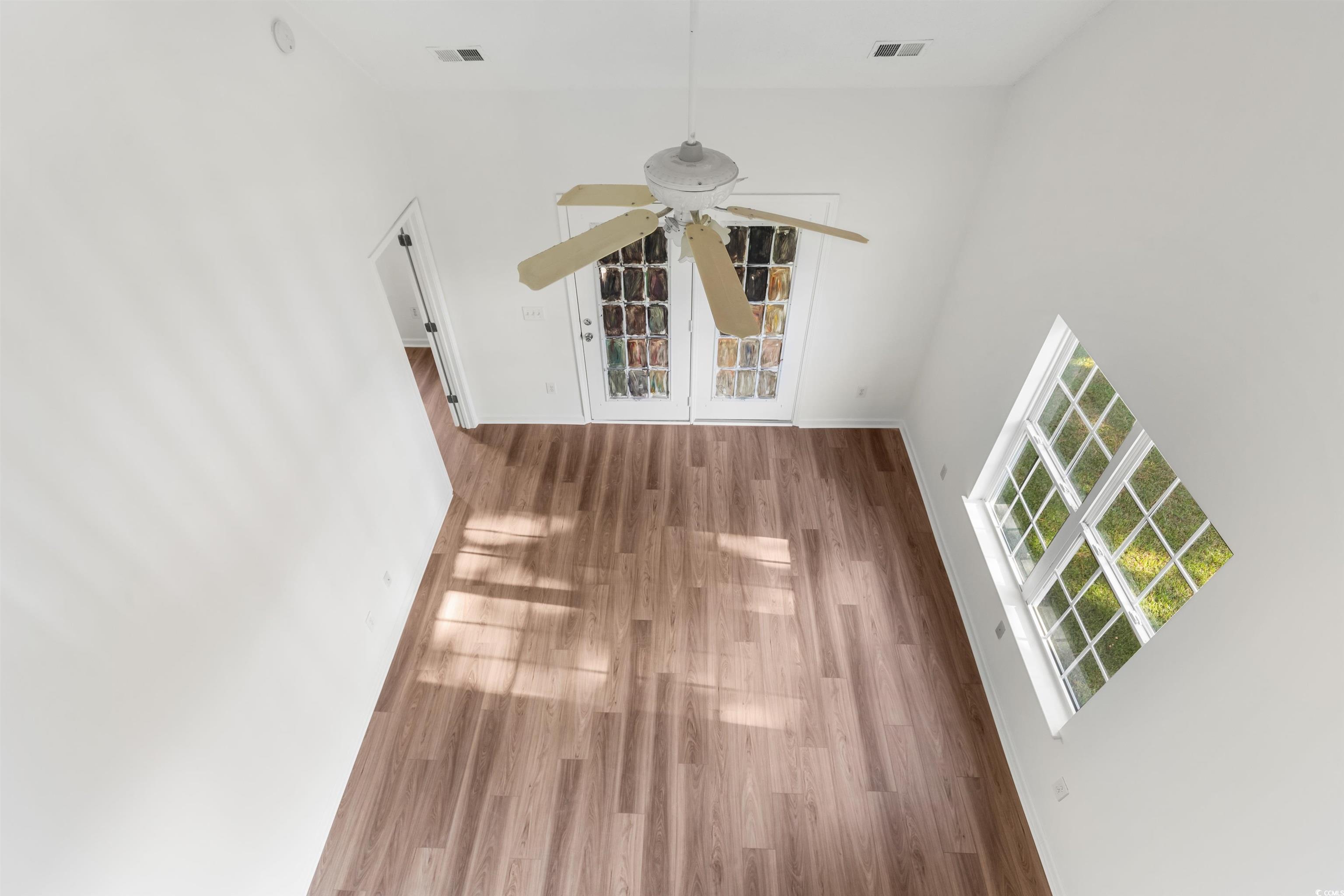 130 Wimbledon Way, Unit 130 Murrells Inlet, SC 29576 - Photo 28 of 38 Spare room with hardwood / wood-style floors, a hi