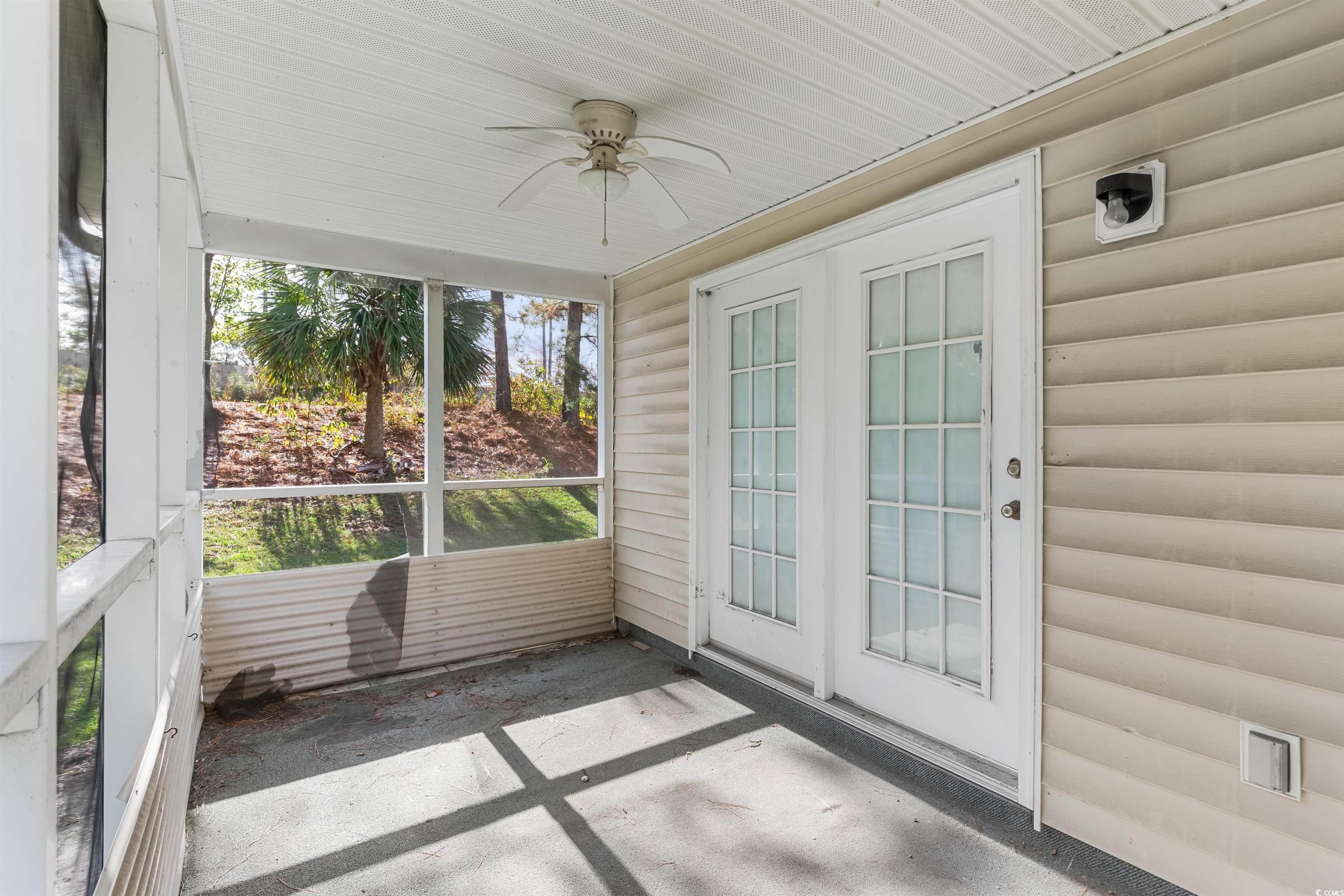 130 Wimbledon Way, Unit 130 Murrells Inlet, SC 29576 - Photo 29 of 38 Unfurnished sunroom with ceiling fan