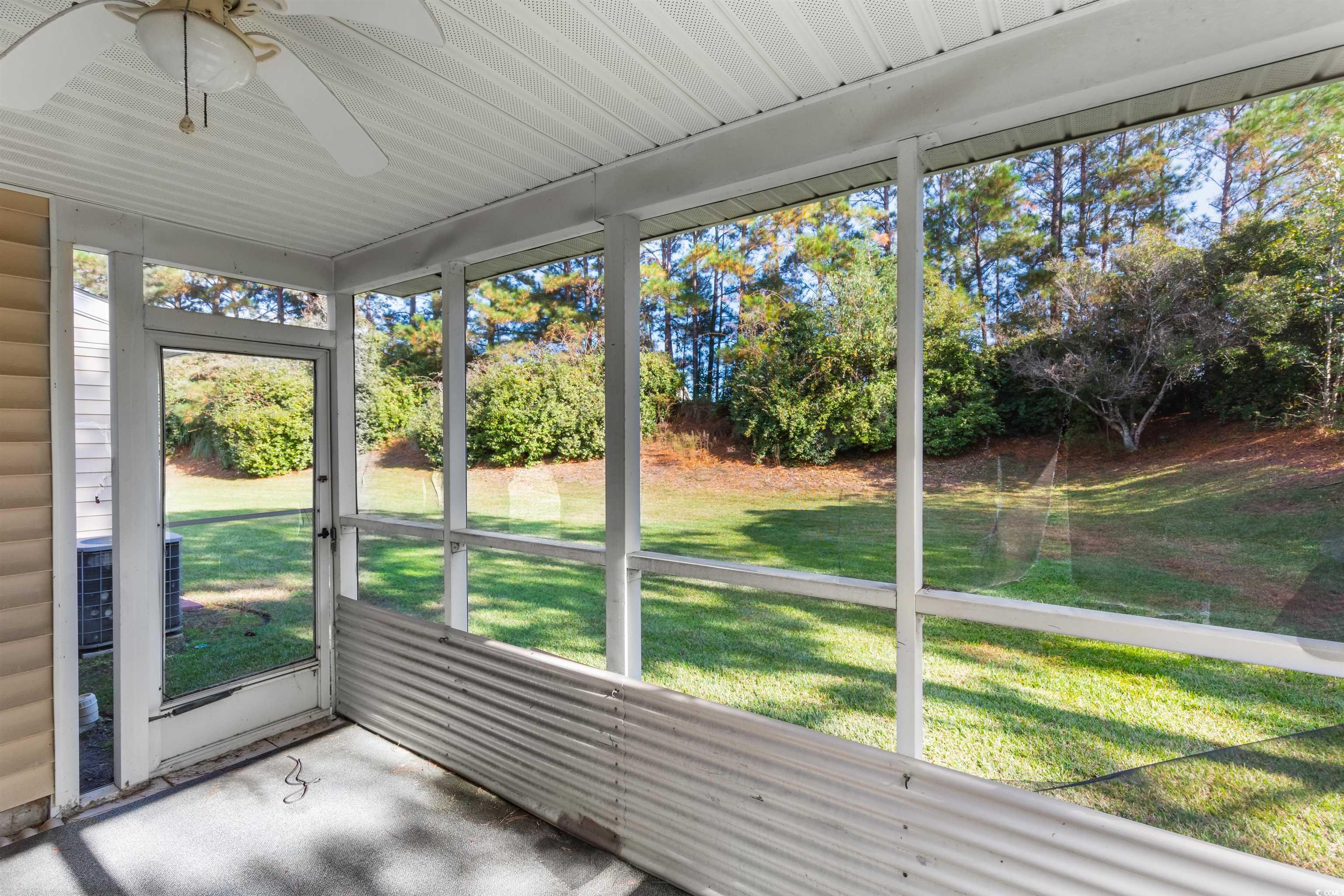 130 Wimbledon Way, Unit 130 Murrells Inlet, SC 29576 - Photo 30 of 38 Unfurnished sunroom featuring a wealth of natural