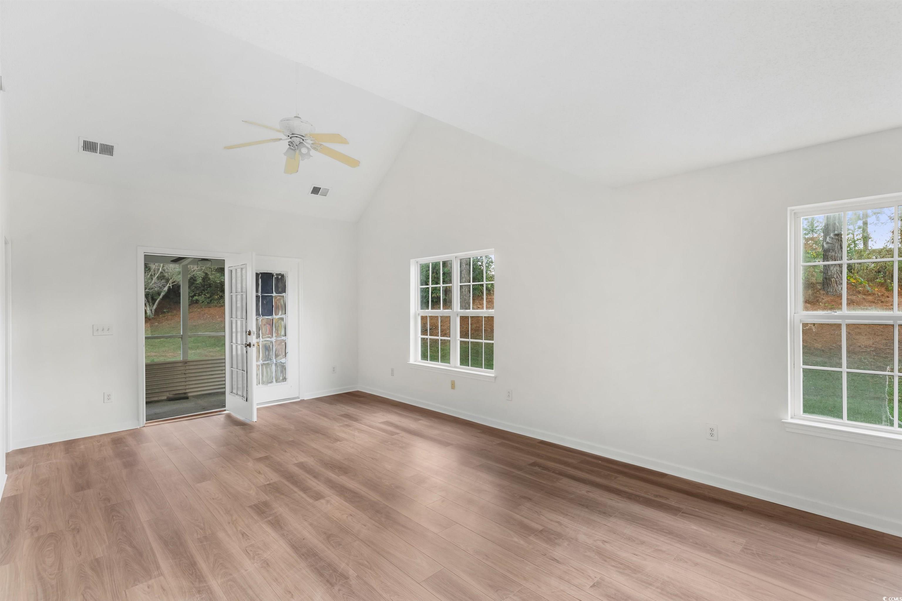130 Wimbledon Way, Unit 130 Murrells Inlet, SC 29576 - Photo 6 of 38 Empty room with high vaulted ceiling, a wealth of