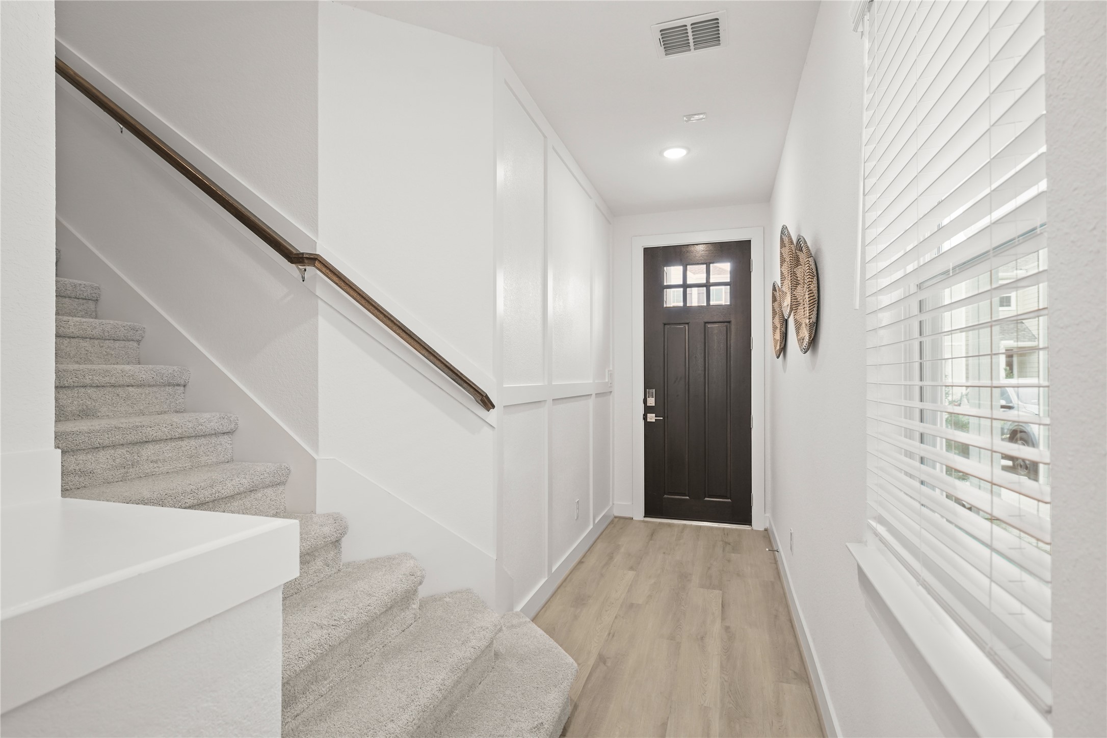 2314 Via Isa Lane Houston, TX 77051 - Photo 4 of 29 a view of a hallway view with wooden floor and staircase