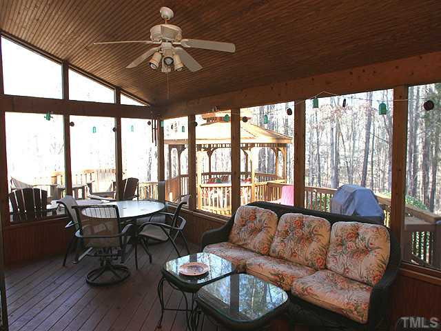 2504 Barton Ridge Court Raleigh, NC 27613 - Photo 19 of 25 Lovely screened porch is not only roomy but has a wonderful view of the hardwoods and the private yard. Screened Porch