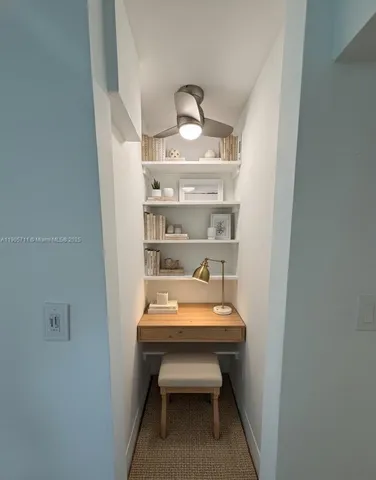 a room with a table and chairs