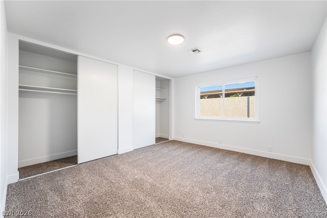 429 Crestway Road Henderson, NV 89015 - Photo 38 of 56 A spacious, naturally illuminated room boasts ample closet space and plush carpeting.