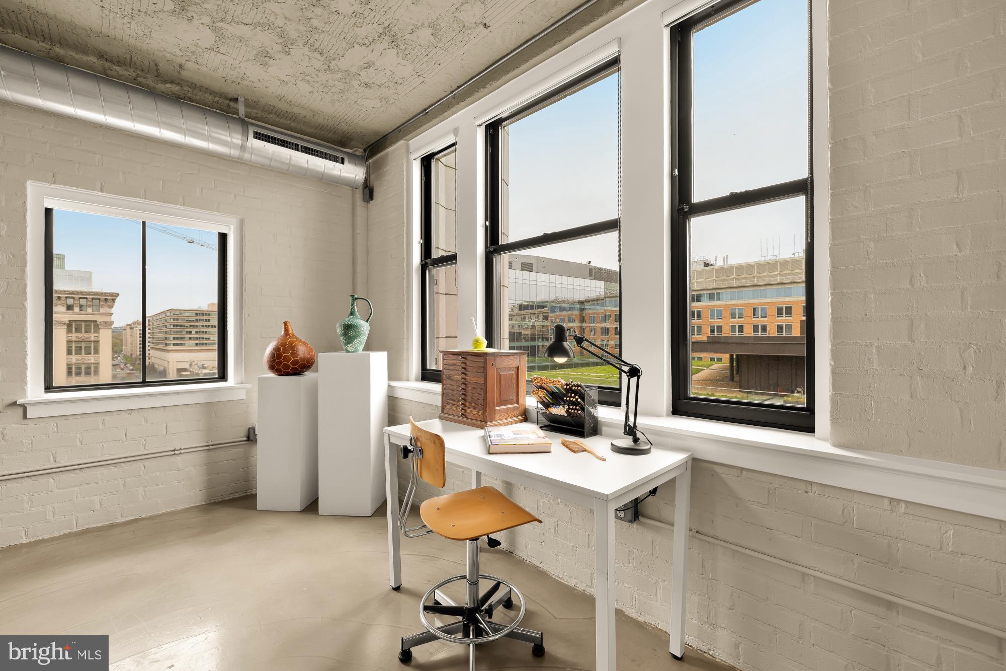 916 G St. Northwest, Unit 806 Washington, DC 20001 - Photo 4 of 19 a workspace with furniture and a window