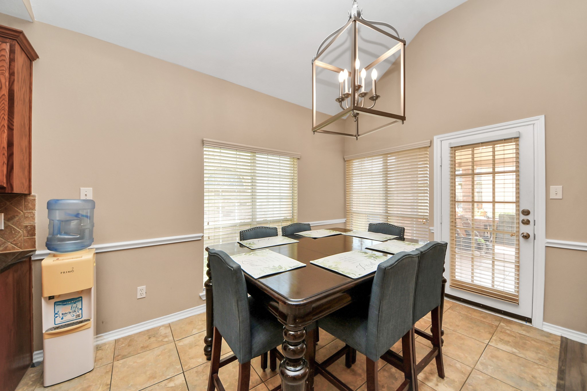 706 River Delta Lane Rosenberg, TX 77469 - Photo 17 of 50 a view of a dining room with furniture wooden floor and chandelier
