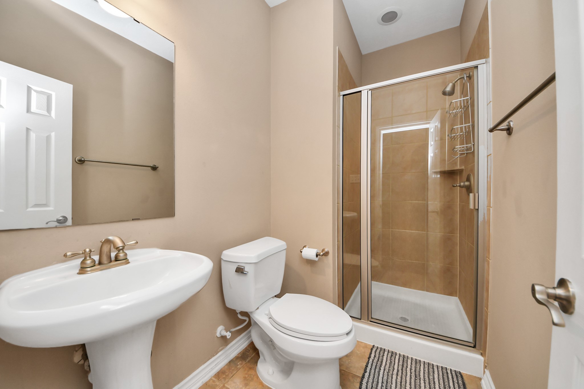 706 River Delta Lane Rosenberg, TX 77469 - Photo 23 of 50 a bathroom with a sink toilet and shower