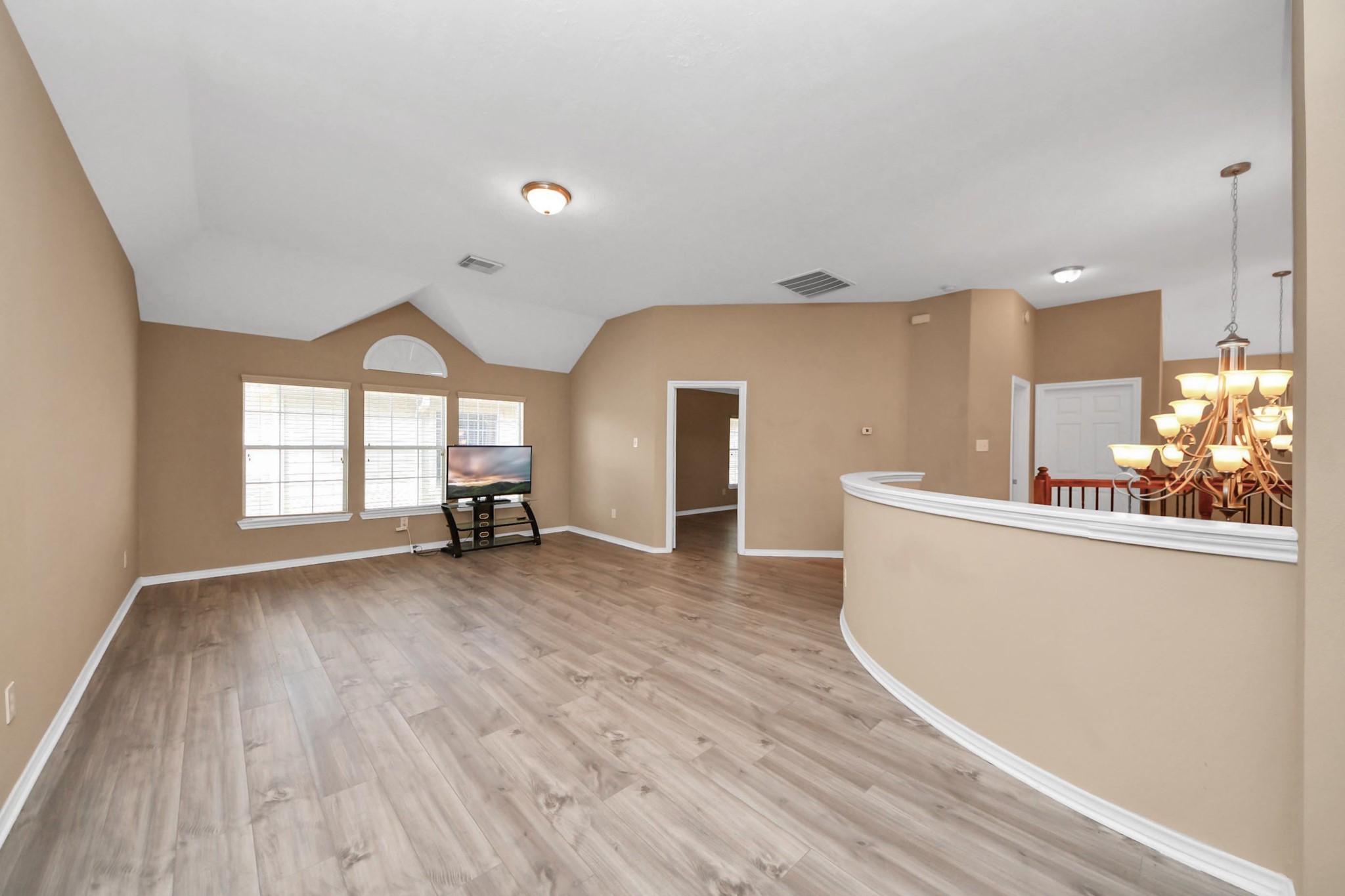 706 River Delta Lane Rosenberg, TX 77469 - Photo 31 of 50 wooden floor in an empty room with a window