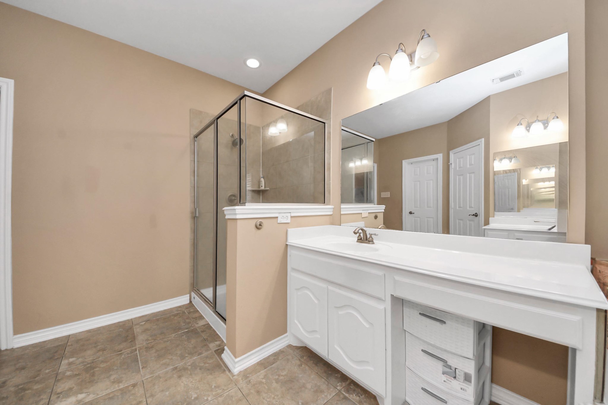 706 River Delta Lane Rosenberg, TX 77469 - Photo 45 of 50 a spacious bathroom with a double vanity sink a mirror and a shower