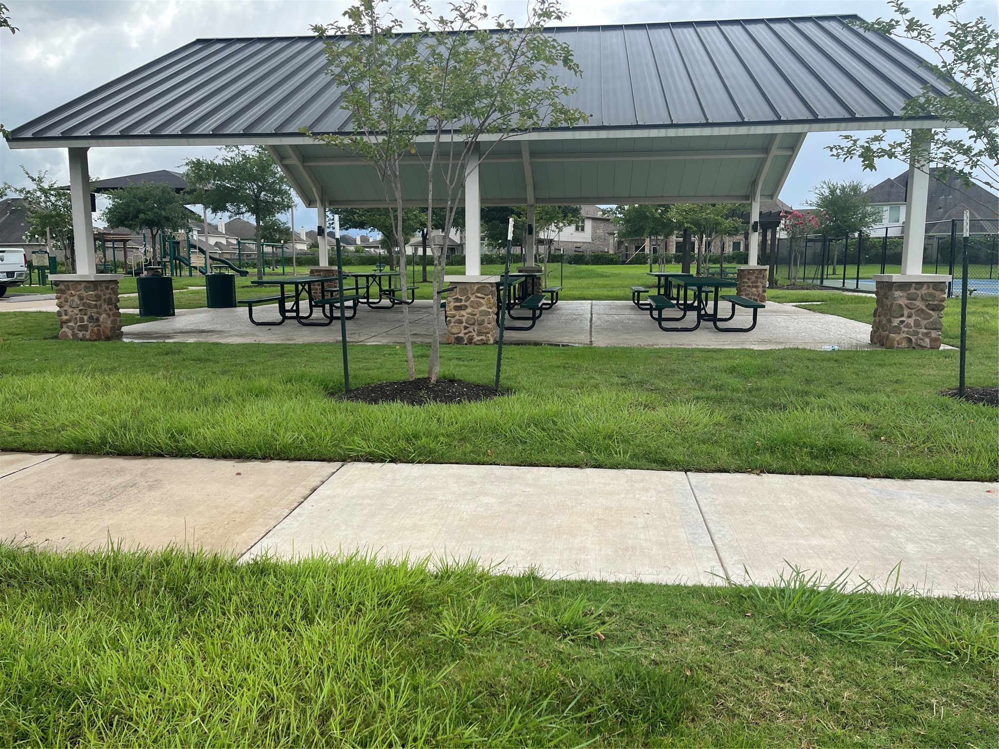 706 River Delta Lane Rosenberg, TX 77469 - Photo 50 of 50 a view of a porch with a table and chairs under an umbrella