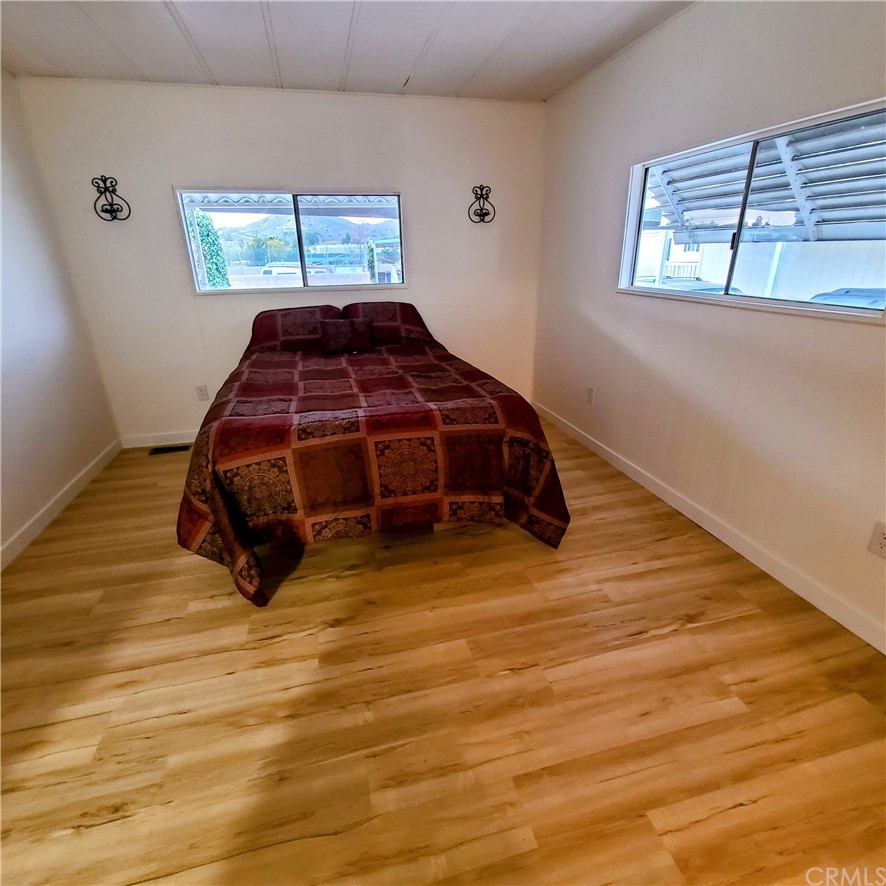 3700 Buchanan, Unit 98 Corona, CA 92503 - Photo 15 of 24 a bedroom with a bed and a window
