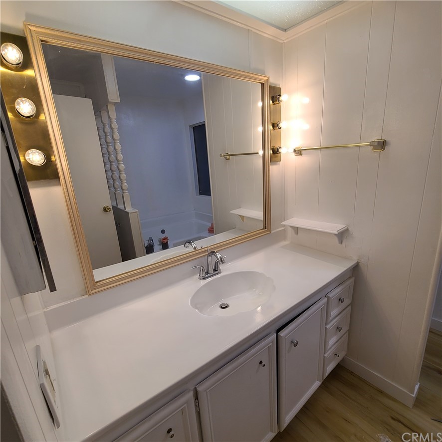 3700 Buchanan, Unit 98 Corona, CA 92503 - Photo 17 of 24 a bathroom with a sink and a mirror