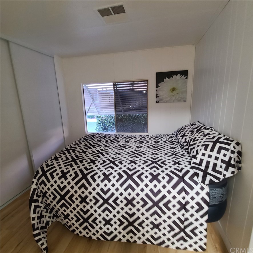 3700 Buchanan, Unit 98 Corona, CA 92503 - Photo 21 of 24 a bedroom with a bed