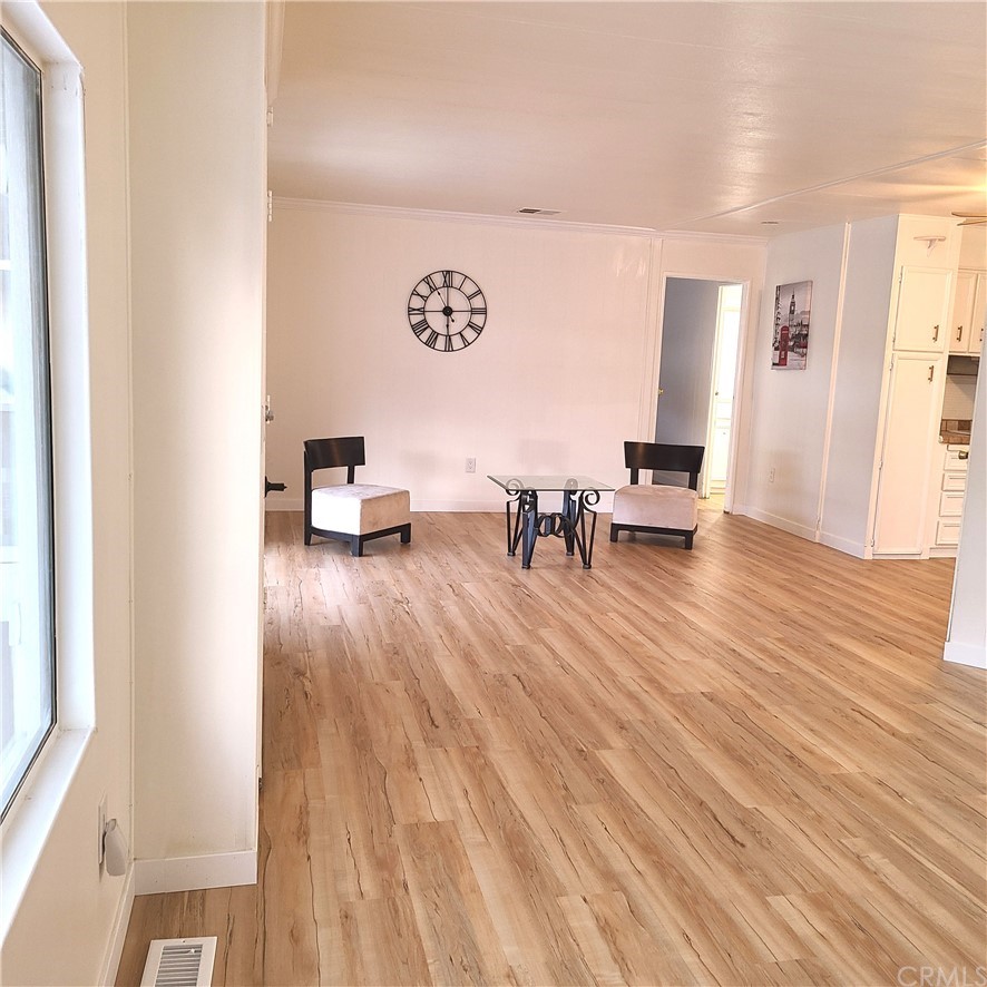 3700 Buchanan, Unit 98 Corona, CA 92503 - Photo 6 of 24 a living room with furniture and a wooden floor