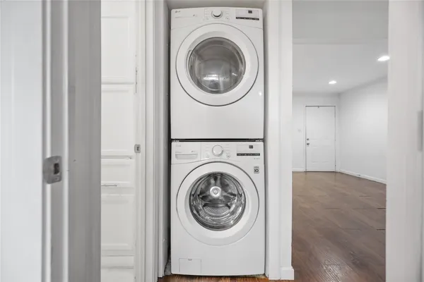 a view of a hallway with washer and dryer