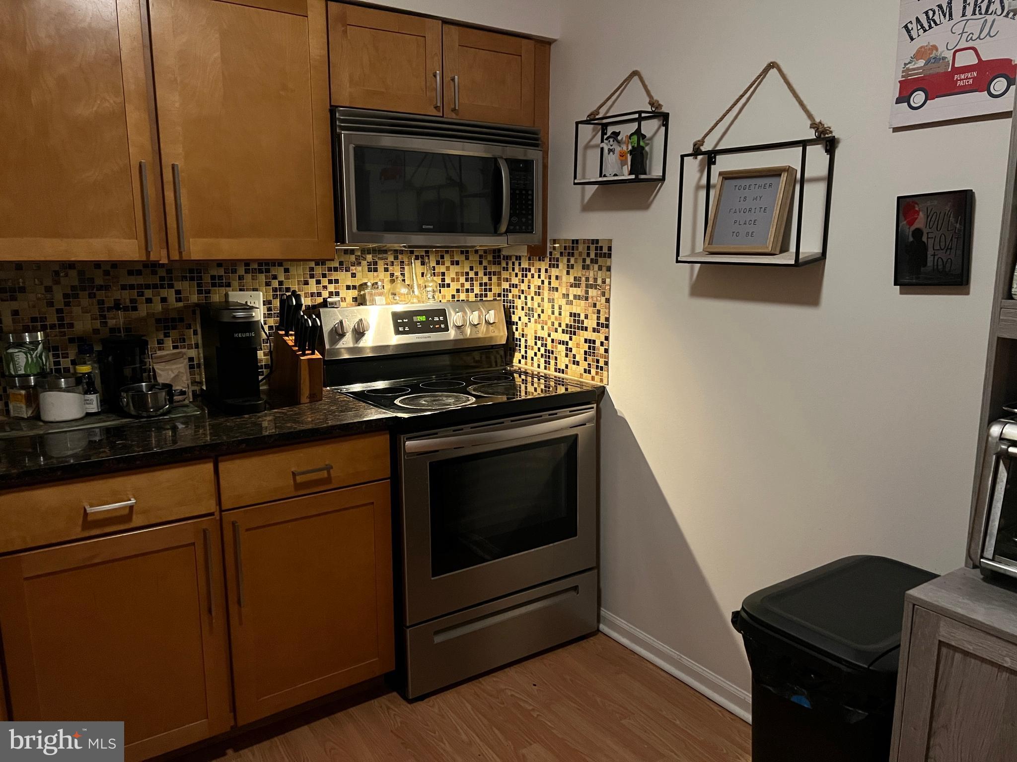 87 Whetstone Road Horsham, PA 19044 - Photo 11 of 20 a kitchen with stainless steel appliances wooden cabinets and stove top oven