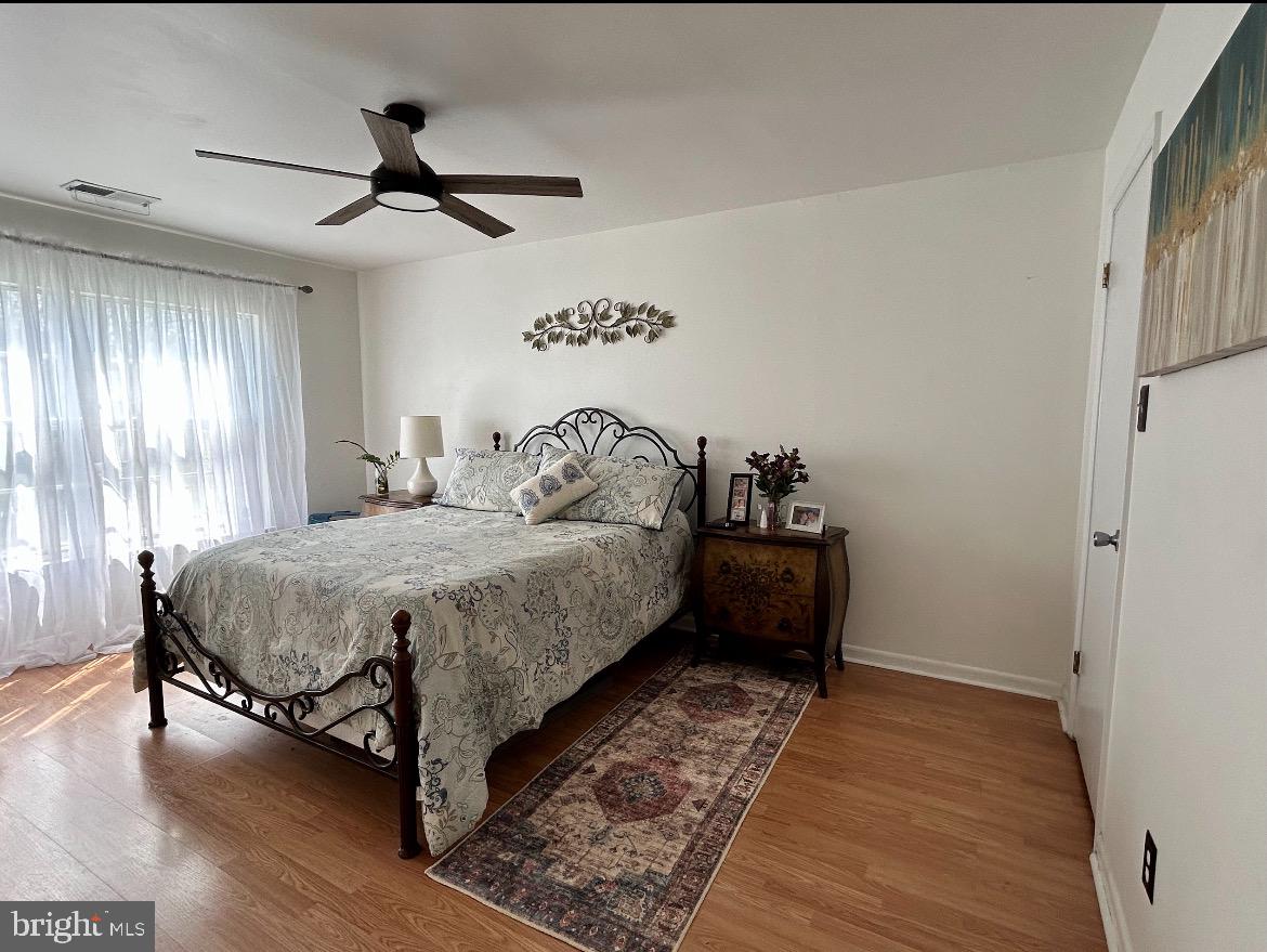 87 Whetstone Road Horsham, PA 19044 - Photo 20 of 20 a bedroom with a bed and wooden floor