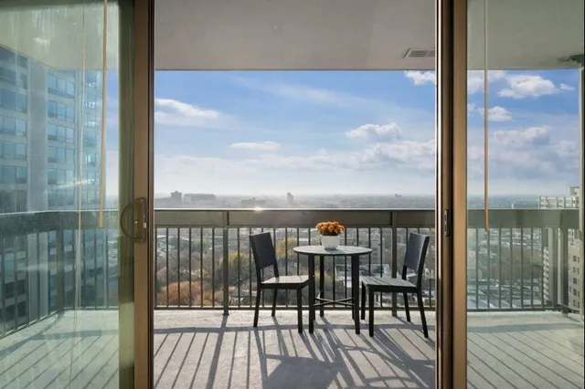 a view of a balcony with chairs