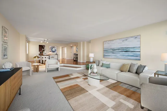 a living room with furniture and white walls