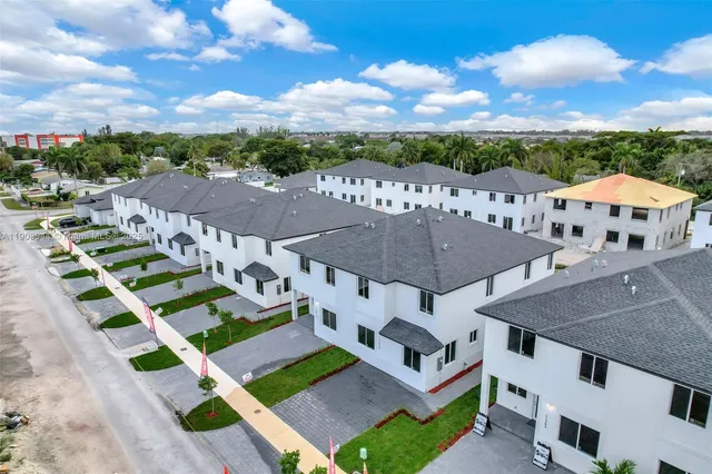 a kitchen with a sink a stove and cabinets