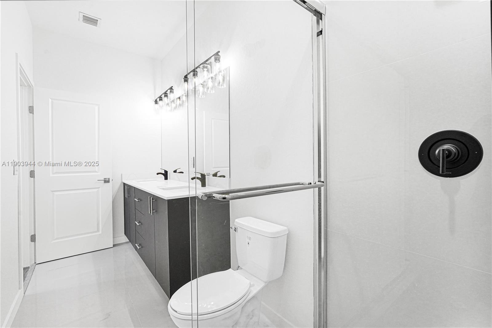 22555 Southwest 125th Avenue, Unit 13A Miami, FL 33170 - Photo 12 of 100 a bathroom with a sink vanity mirror and toilet