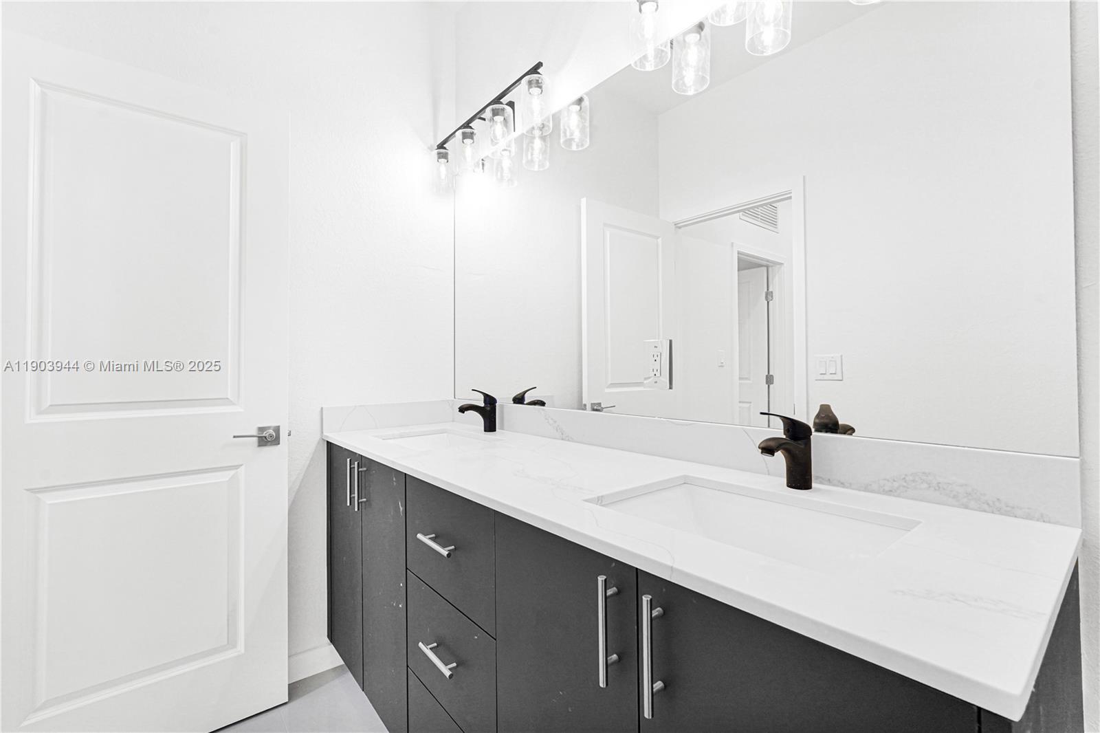 22555 Southwest 125th Avenue, Unit 13A Miami, FL 33170 - Photo 13 of 100 a bathroom with a sink and a mirror