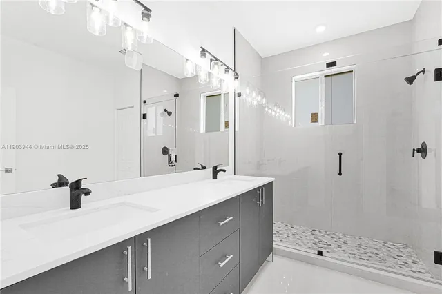 a kitchen with granite countertop a sink a stove and cabinets
