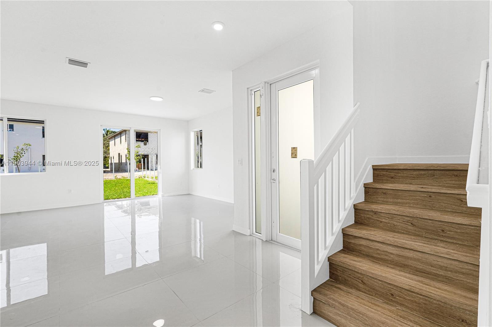22555 Southwest 125th Avenue, Unit 13A Miami, FL 33170 - Photo 17 of 100 a view of an entryway with wooden floor