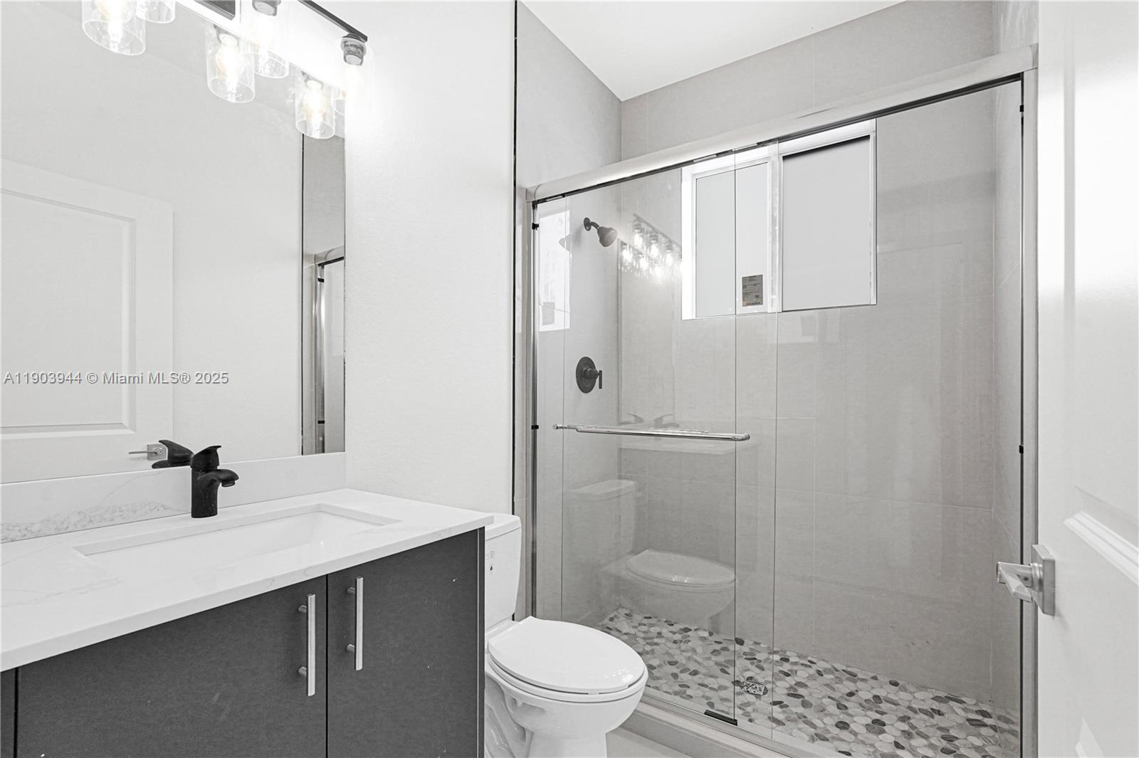 22555 Southwest 125th Avenue, Unit 13A Miami, FL 33170 - Photo 35 of 100 a bathroom with a sink a toilet and shower