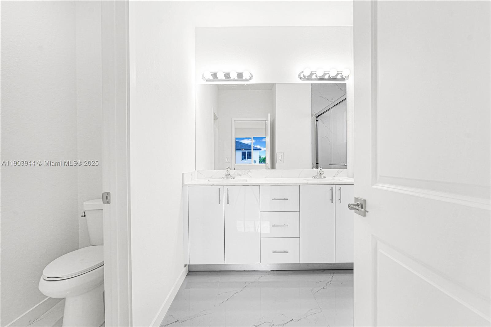 22555 Southwest 125th Avenue, Unit 13A Miami, FL 33170 - Photo 60 of 100 a bathroom with a sink vanity mirror and toilet