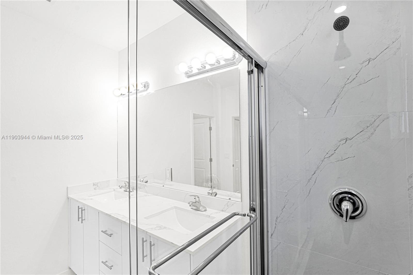 22555 Southwest 125th Avenue, Unit 13A Miami, FL 33170 - Photo 63 of 100 a bathroom with a sink and a mirror