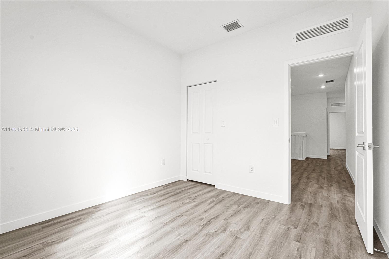 22555 Southwest 125th Avenue, Unit 13A Miami, FL 33170 - Photo 69 of 100 a view of a room with wooden floor