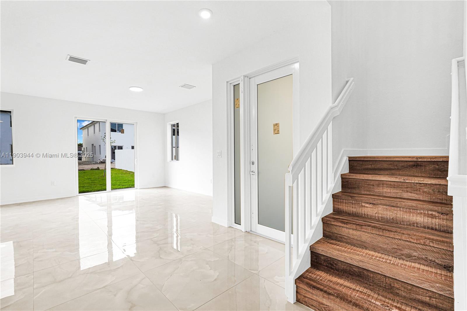 22555 Southwest 125th Avenue, Unit 13A Miami, FL 33170 - Photo 88 of 100 a view of an entryway with wooden floor