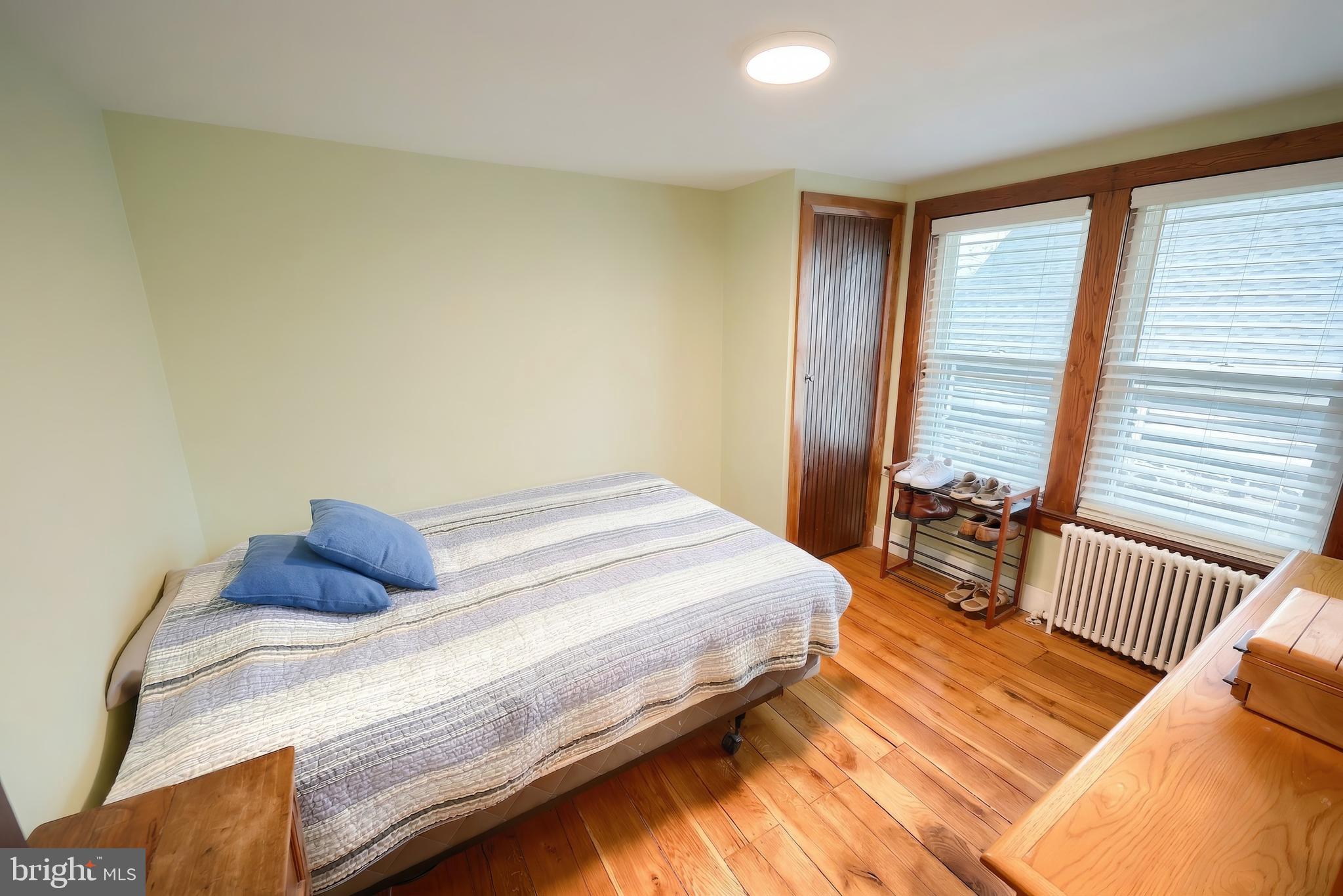 24 Park Street Jacobus, PA 17407 - Photo 16 of 40 a bedroom with a bed and a window