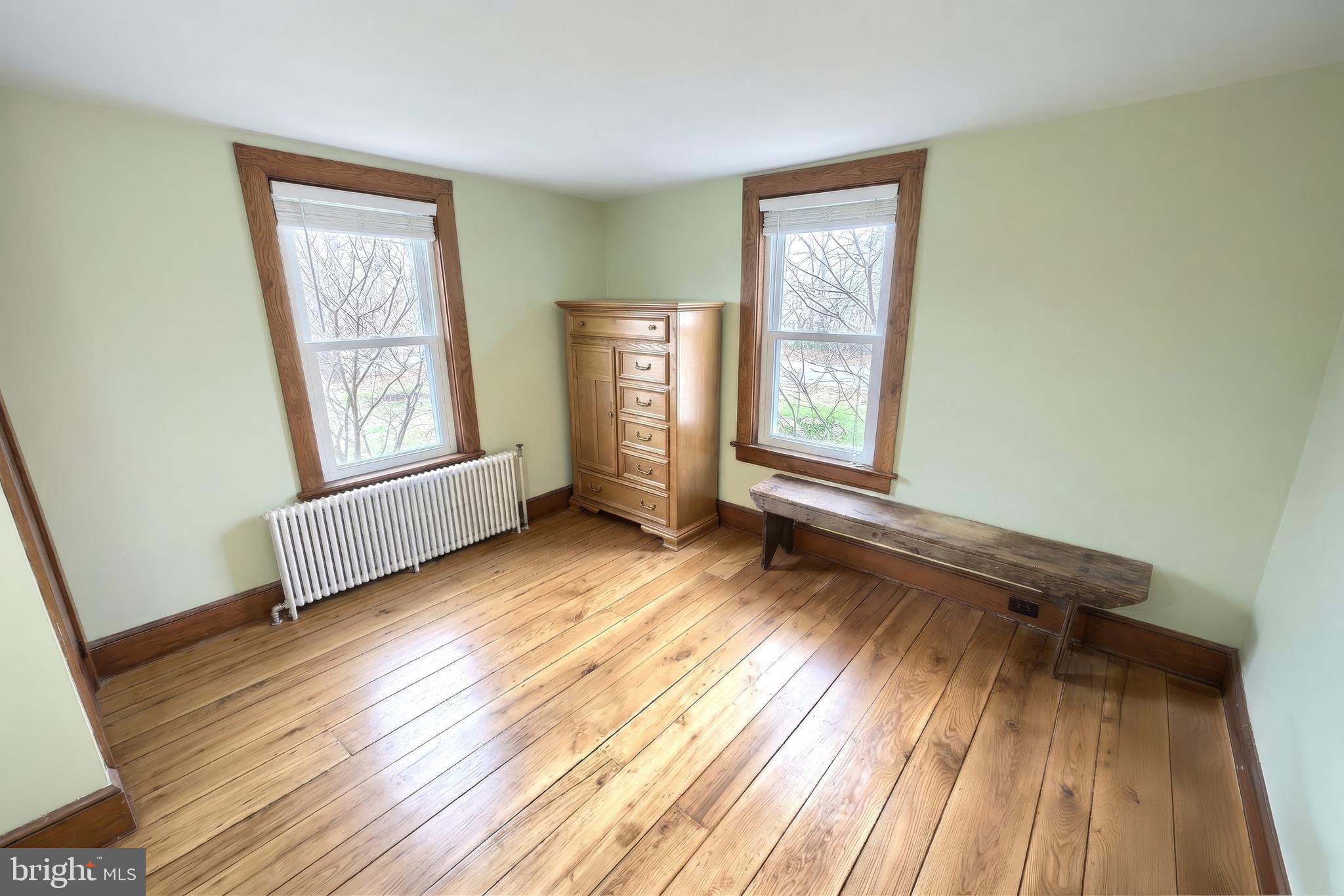 24 Park Street Jacobus, PA 17407 - Photo 17 of 40 an empty room with wooden floor and windows