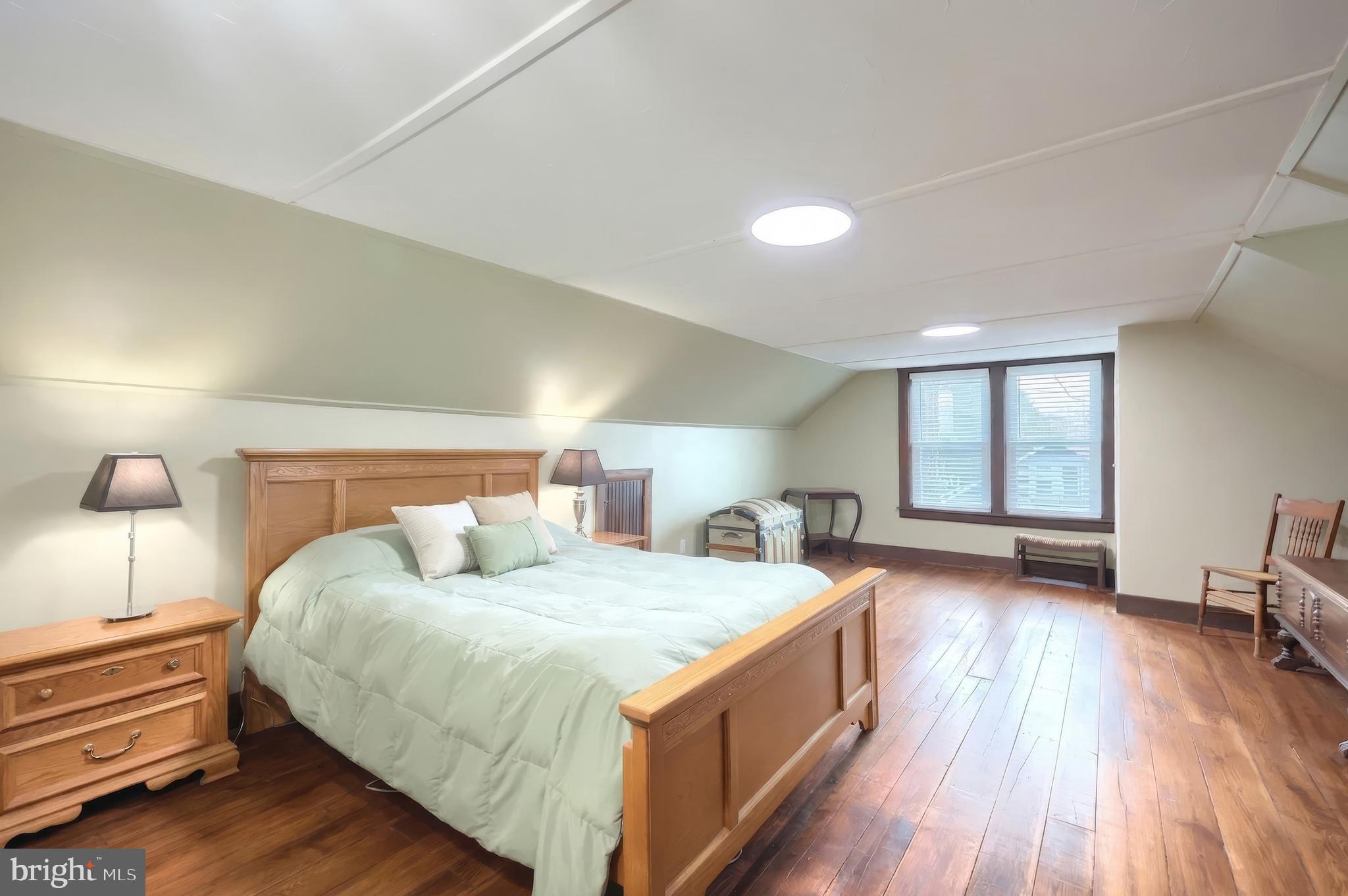 24 Park Street Jacobus, PA 17407 - Photo 26 of 40 a bedroom with a bed and wooden floor