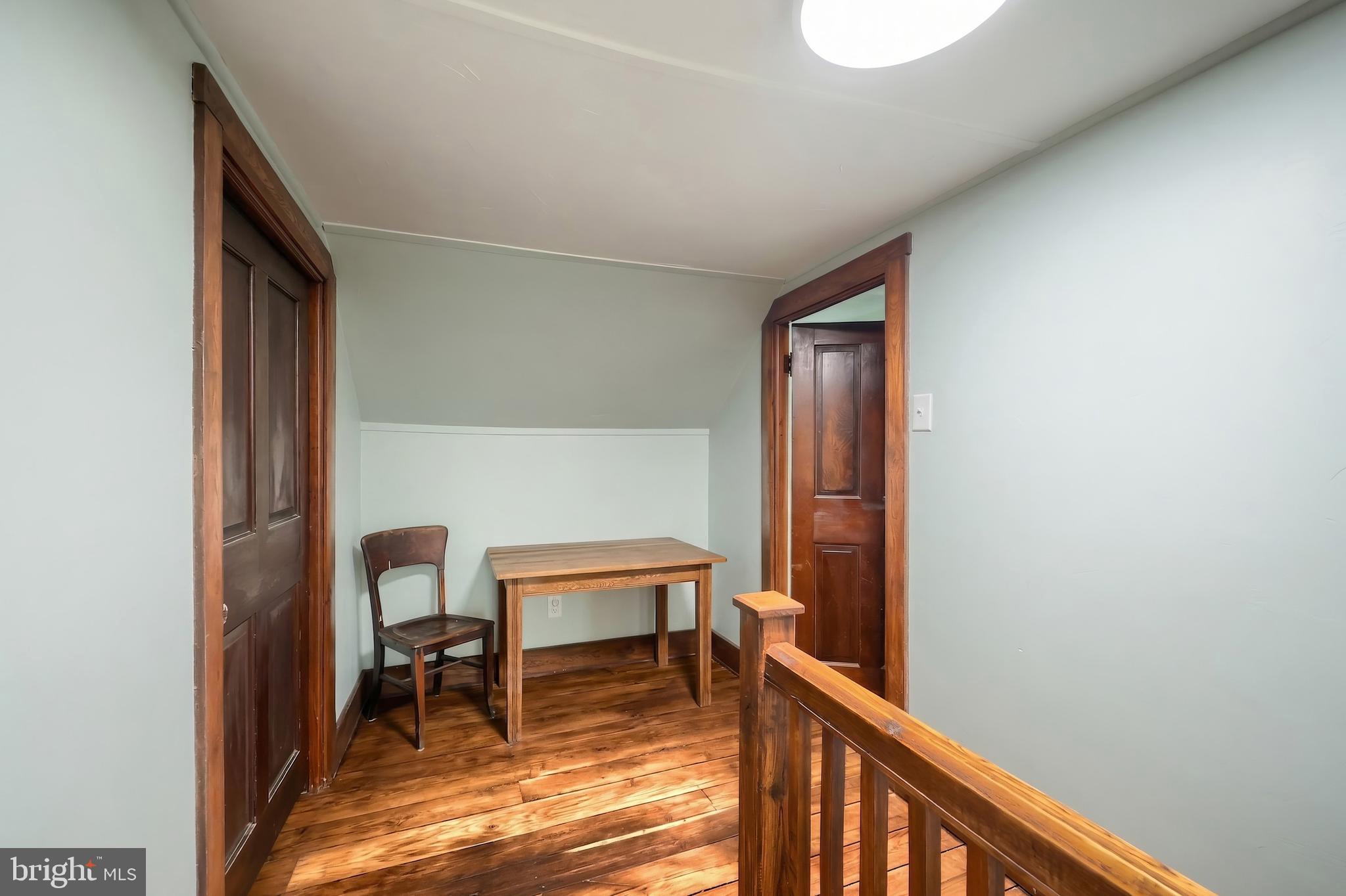 24 Park Street Jacobus, PA 17407 - Photo 28 of 40 a view of a hallway with wooden floor and a bathroom