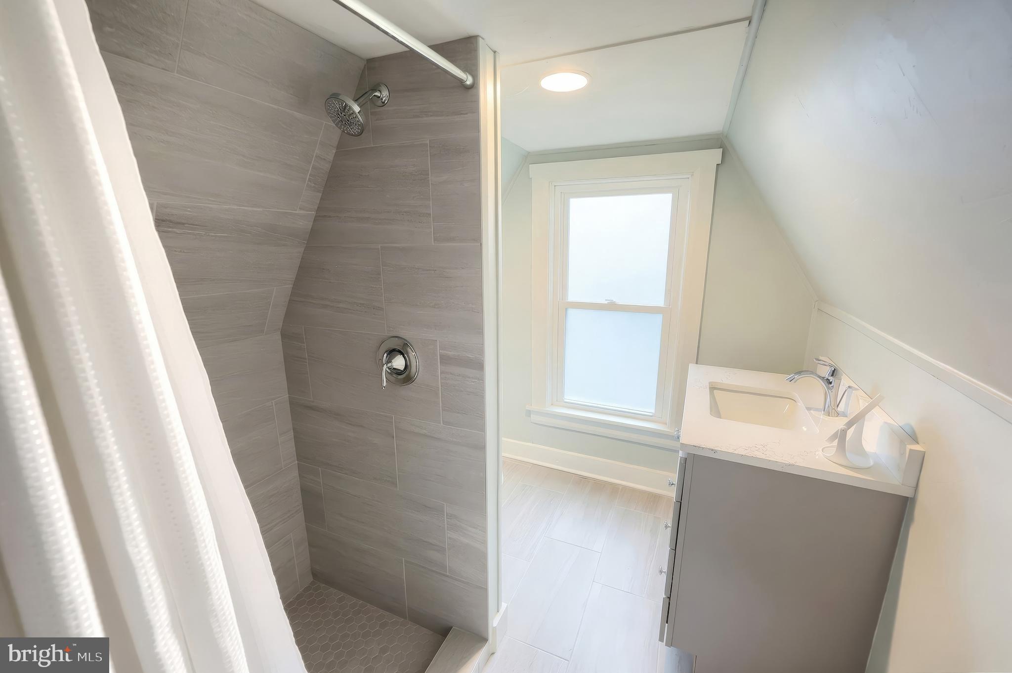 24 Park Street Jacobus, PA 17407 - Photo 31 of 40 a bathroom with a tub sink and shower