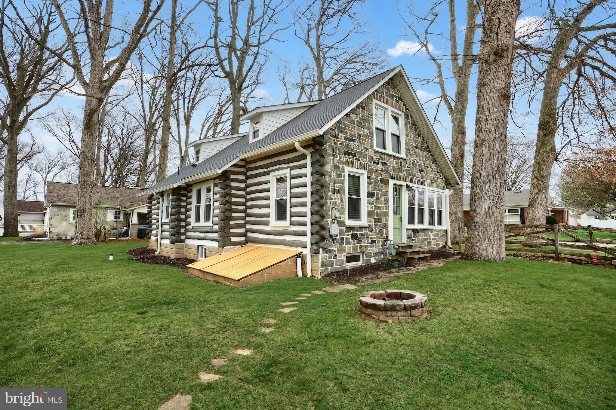 24 Park Street Jacobus, PA 17407 - Photo 4 of 40 a front view of a house with a yard and trees