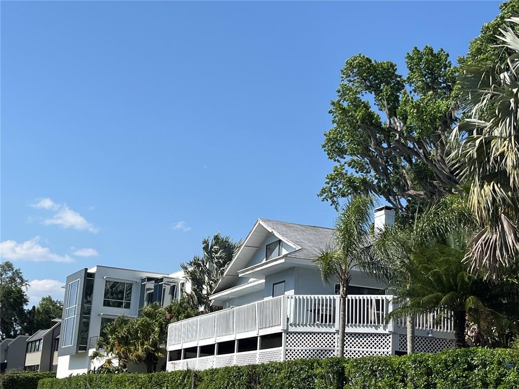 629 Helen Street Mount Dora, FL 32757 - Photo 7 of 9 a front view of a house with a garden